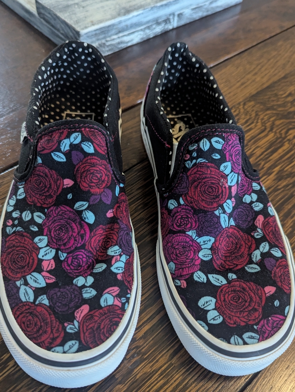 Vans Black Slip-On Sneakers with Pink and Teal Floral Accents